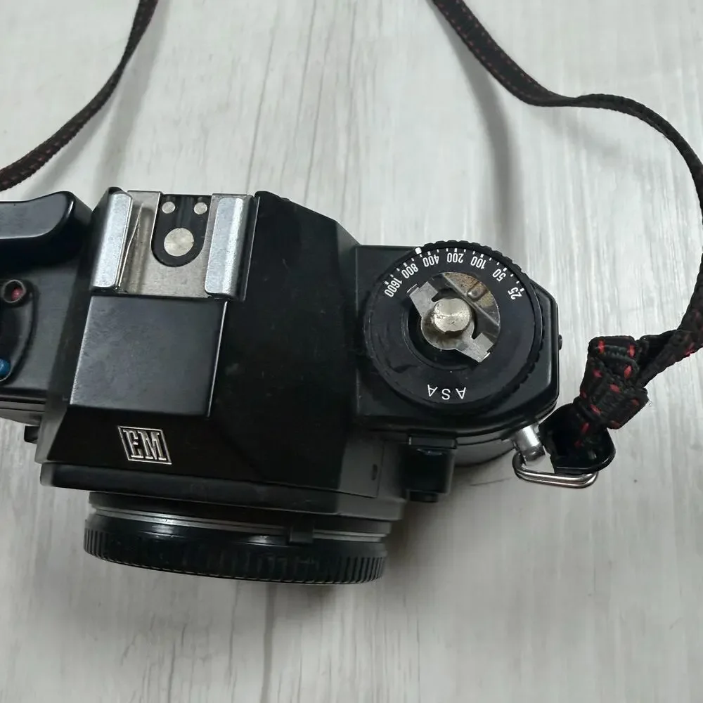 Nikon EM 35mm Film SLR Camera Body, Black (Body Only) for parts or repair